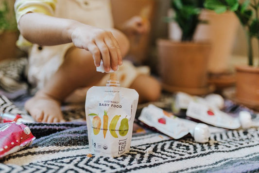 toddler enjoying biodynamic baby food puree