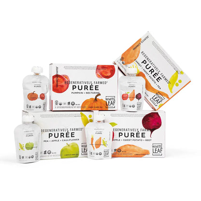 Assorted packages of White Leaf Puree Baby Food Pouches on a white background